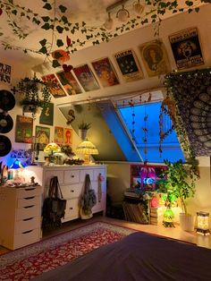 a bedroom with lots of plants hanging from the ceiling