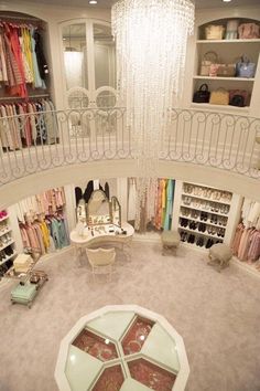 the inside of a clothing store with chandelier