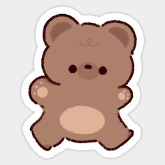 a brown teddy bear sticker sitting on top of a table