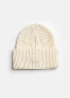 Our warmest Mad Hatter beanie is here. Featuring a thick, rib knit and a double rolled cuff. OS.100% acrylic rib knit. Bar Apron, Ribbed Knit Beanie, Hair Necklace, Bar Coasters, Candle Wrap, Cocktail Book, Knit Bottom, Back Bag, Print Calendar