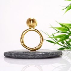 Chunky gold ball ring.A minimalist stacking ring with a solid silver sphere element.The organic irregularity of the sphere and shank give this ring a very unique character.This listing is for the bigger one of the two worn on the hand.Dimensions:Sphere diameter   10 – 11mmShank thickness    2,5 – 3,5mmWeight: >10grFor the smaller one view: https://www.etsy.com/listing/855558305/silver-ball-ring-statement-ring-silver?ref=shop_home_active_18&pro=1&frs=1This ring is available in:• Plain Sphere Ball Ring, Sphere Ring, Gold Statement Ring, Ringe Gold, Geometric Ring, Chunky Rings, Statement Ring Silver, Gold Band Ring, Ring Minimalist