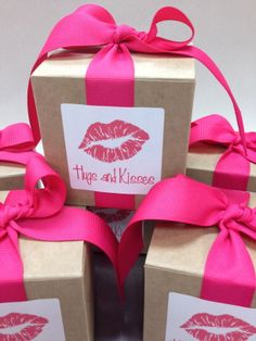 six wrapped presents with pink ribbon tied around them and the words tips and kisses written on each box