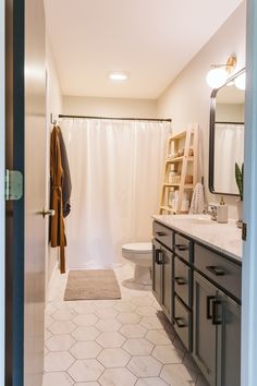 the bathroom is clean and ready to be used as a guest room or family room