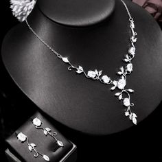 A delicate bridal jewelry set with a romantic scrolling vines design! Adorned with intricately faceted cubic zirconia that capture the light from every angle with a perfectly translucent appeal, the pieces are platinum plated for a flawless finish which enhances the intricate detailing and conveys a modern take on old elegance. Necklace: 16" (approx. 40.6cm) long with a 2" (approx. 5cm) extension chain for comfortable sizing. Closure is a secure lobster clasp. Earrings: 1.2" (approx. 3cm) long a Delicate Bridal Jewelry, Conceptual Jewelry, Vines Design, Clasp Earrings, Platinum Necklace, Vine Wedding, Wedding Silver, Geek Jewelry, Wedding Jewelry Set