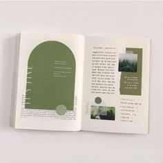 an open book with pictures and text on the pages, sitting on top of a white surface