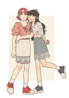 two girls hugging each other while wearing skirts