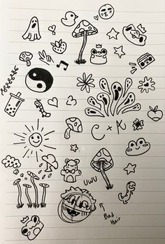 some doodles are drawn on top of a piece of paper with various symbols in it