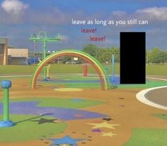 there is a play area in the park with stars on it and an arrow pointing to leave as long as you still can