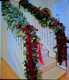 christmas garland on the banisters with red bows