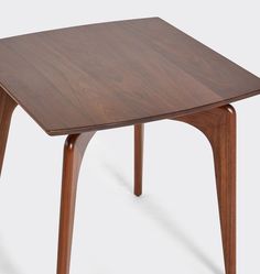 a wooden table with two legs and a square top on the bottom, in front of a white background