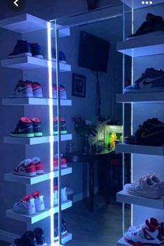 an illuminated shoe rack in the corner of a room