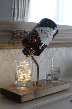 Lamps From Bottles, Gin Bottle Lamp Diy, Gin Bottles Upcycle, Hendricks Gin Bottle Ideas, Bottle Lamp Ideas, Liqour Bottles, Liquor Bottle Lights, Diy Bottle Lamp, Liquor Bottle Lamp