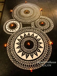 an intricately decorated floor with candles on it