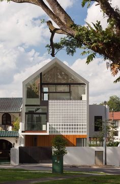 the house is made up of two different sections, one with an open roof and one with a large window