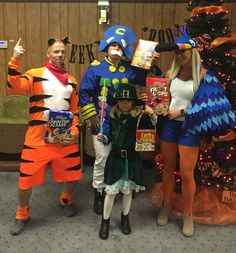 three people in costumes posing for a photo