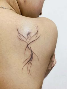 a woman with a tattoo on her back