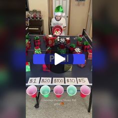 a man standing in front of a table filled with presents