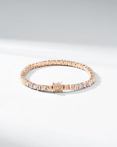 Crafted in 18-karat gold, this tennis bracelet incorporates our beloved baguette diamonds unevenly set while interchanging them with sections of gold all the way around. We love this piece for its seamless design and everyday wearability. The perfect baguette tennis bracelet to instantly elevate any outfit, casual or formal. Details 18k yellow gold, rose gold or white gold 2.00 carats of white diamond baguettes Bracelet measures 7" inches in length Box clasp with safety lock fastening 5mm width Luxury Rose Gold Diamond Bracelet With Baguette Diamonds, Elegant Rose Gold Baguette Diamond Tennis Bracelet, Baguette Cut Diamond Bracelets, Timeless Everyday Luxury Diamond Bracelet With Baguette Diamonds, Modern Tennis Bracelet With Baguette Diamonds And Cubic Zirconia, Luxury Rose Gold Tennis Bracelet With Baguette Diamonds, Gold Tennis Bracelet With Baguette Diamonds, Timeless Everyday Luxury Tennis Bracelet With Baguette Diamonds, Rose Gold Baguette Cut Tennis Bracelet For Formal Occasions