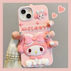 someone is holding up their phone case with hello kitty on it