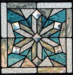 a stained glass window with many different shapes