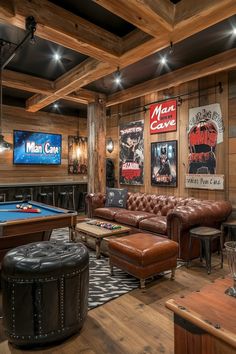 a man cave with leather couches and pool tables