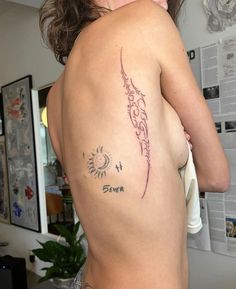 a woman with a tattoo on her back