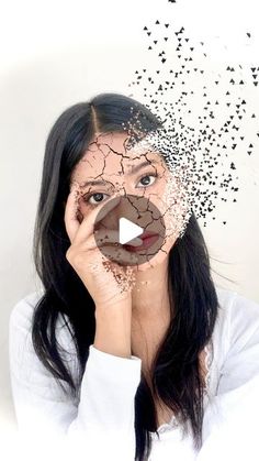 a woman is holding her face up to the camera with birds flying around her head