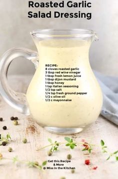 the recipe for roasted garlic salad dressing in a glass pitcher