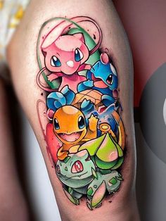 an image of a tattoo on the leg of a person with pokemon characters in it