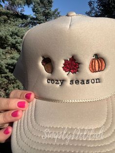 Be the first to welcome fall with this cozy season hat. I have embroidered fall icons on this cute trucker hat. An acorn, fall leaf and a pumpkin to give you all the fall vibe feels!  This stylish trucker hat is embroidered by me from high-quality thread and features intricate embroidery detail that adds a personalized touch to your everyday look for this cozy season.  Whether you're treating yourself or looking for a hat to wear to the pumpkin patch, this fall style will definitely  stand out t Brown Winter Trucker Hat, Cute Brown Hat For Fall, Cozy Fall Cap, Fall Outdoor Snapback Hat, Outdoor Fall Snapback Hat, Fall Outdoor Baseball Cap, Cute Beanie Hats For Fall, Trendy Fall Snapback Baseball Cap, Adjustable Fall Trucker Hat With Curved Brim