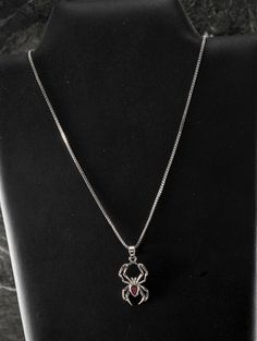 For sale is a vintage spider pendant necklace. This necklace shows a spider with a faceted red gem center on an 18" box chain. The pendant measures 3/4".  New treasures added all the time, check back often! Chinese Goddess, Spider Pendant, Vintage Spider, Spider Jewelry, Spider Necklace, Chain Silver, Wedding Jewellery Necklace, Grunge Aesthetic, Box Chain