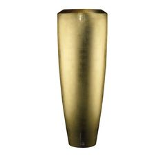 a tall gold vase sitting on top of a table