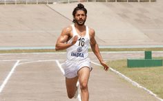 a man running on a track with no shoes