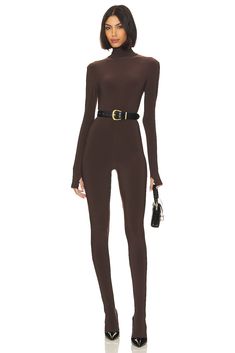 The first designer to receive a plaque on New York's 7th Avenue, she is credited with inventing the sleeping bag coat, the silk parachute look, high heeled sneakers, and the popular packable, multi-use poly jersey. Let Norma Kamali show you the way.Turn heads with Norma Kamali's Slim Fit Turtle Catsuit in Chocolate. This alluring piece features turtleneck styling, attached sock foot, and a thumbhole design . Pair it with black pumps and the perfect belt for a sensational night out..  95% polyest Turtleneck Style, High Heel Sneakers, All Black Everything, Norma Kamali, Long Jumpsuits, All Black Outfit, Fashion Help, Catsuit, Black Pumps