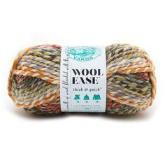 wool ease yarn in multicolors with white and orange stripes on the top,