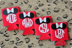 three mickey mouse iron - on patches with monogrammed letters and bows are sitting next to each other