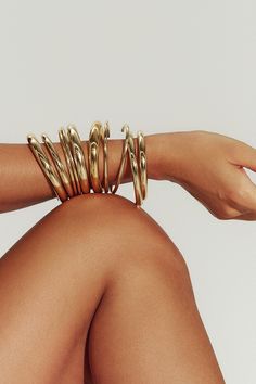 Filled with 18K gold, our Brazil-made tube cuff is the dynamic final touch – or the gleaming foundation of a sculptural bracelet stack. Mix in varying widths and finishes for the most impact. Jewelry Collection Handcrafted in Brazil 18K Gold Filled Thickness: 8.4mm Inner Diameter: 2.5" Opening: 1.25" Weight: 0.38 oz Waterproof Hypoallergenic