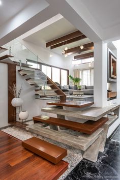 the stairs are made of concrete and wood