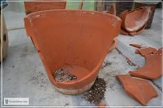 several clay pots with dirt on the ground