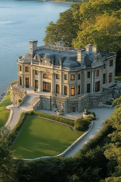 this is an aerial view of a large mansion in the middle of a body of water