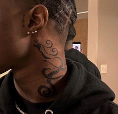 a woman with a tattoo on her neck