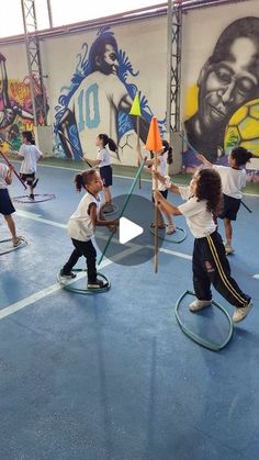 several children are playing with toys in an indoor gym