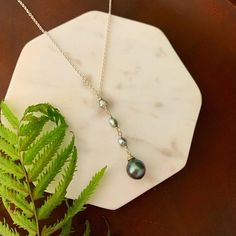 Looking for something unique and different. This beautiful necklace displays a nice and small Tahitian Pearl paired with small and dainty Tahitian keshis pearls . ✨Necklace length : 17-18” if you need a different size please specify at checkout . There is an extender on the back to make it more versatile and can be adjusted slightly ,about 1” . ✨Pendant length: approximately 2 inches.✨Tahitian pearl :Size : 8-9mm small and dainty size Shape : Tear dropColor : Color may varyQuality : Good overall Tahitian Pearls Jewelry, Necklace Displays, Tahitian Pearl Earrings, Keshi Pearl Necklace, Tahitian Pearl Necklace, Pearl Drop Necklace, Hawaiian Jewelry, Tahitian Black Pearls, String Of Pearls