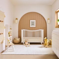 a baby's room with a crib and toys