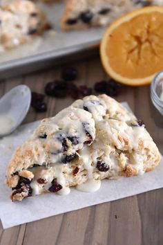 an orange and cranberry scones with icing