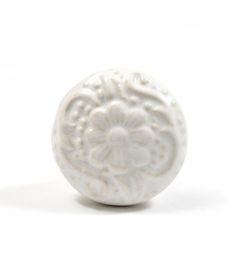 a white ceramic object on a white background