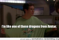 the young man is wearing a green t - shirt that says i'm like one of those dragon from avatar