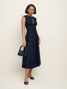 Romance for one.  Shop the Renaie Dress from Reformation, a midi length dress with cap sleeves, a drop waist, buttons along the bodice, and center front cutout. Italian Summer Outfits, Dress With Cap Sleeves, Time Clothes, Flirty Tops, Italy Outfits, Swimwear Dress, Dropwaist Dress, Midi Length Dress, Linen Clothes