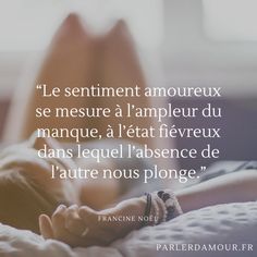 a woman laying on top of a bed next to a quote from the french language