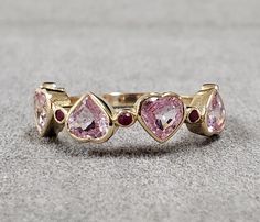 1. Pink Sapphire and Ruby 14k Gold Ring 2. Solid Gold 3. Gemstone - Pink Sapphire, Ruby  4. Jewelry Type - Gold Ring 5. Total Weight - 2.920 Gram Approx. 6. Sapphire Weight - 2.25 Carats  7. Ruby Weight - 0.10 Carats 8. Gold Weight - 2.450 Grams Approx.  9. Sapphire Size - 4.50 x 4.50 MM Approx.    10. Gold Purity - 14k 11. Band Size - 1.80 MM 12. Handmade Items 13. AAA Quality Ring 14. Pink Sapphire Heart 15. 1 Quantity Available 16. Ready to Dispatch in 1 - 2 days. 17. 14k Stamped  Pictures are taken under natural and day light. Fine Jewelry With Bezel Setting For Valentine's Day, 14k Gold Jewelry With Bezel Setting For Valentine's Day, Bezel Set Jewelry For Anniversary On Valentine's Day, Valentine's Day Jewelry Ring With Bezel Setting, Multi-stone Rings For Anniversary On Valentine's Day, Valentine's Day Bezel Setting Ring Jewelry, Valentine's Day Round Rose Cut Diamond Jewelry, Valentine's Day Rose Cut Diamonds Jewelry, Valentine's Day Rose Cut Round Diamonds Jewelry